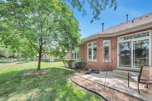 10754 Canterbury Dr, Mokena, IL 60448 - view of grassy yard featuring a patio area
