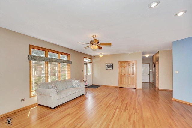10754 Canterbury Dr, Mokena, IL 60448 - living area with light wood-style floors and a ceiling fan