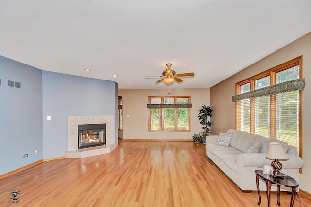 10754 Canterbury Dr, Mokena, IL 60448 - living area with light wood-style flooring, ceiling fan, a fireplace, and recessed lighting