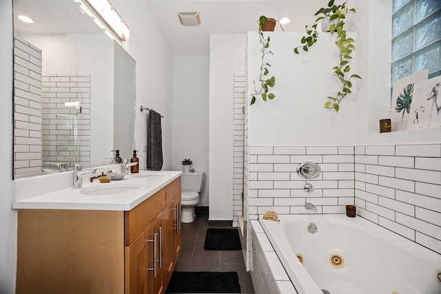 823 N Marshfield Ave Unit 2, Chicago, IL 60622 - full bath featuring vanity, a jetted tub, and tile patterned flooring
