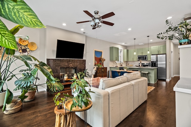 823 N Marshfield Ave Unit 2, Chicago, IL 60622 - living area featuring ceiling fan, recessed lighting, a tiled fireplace, and dark wood-style floors