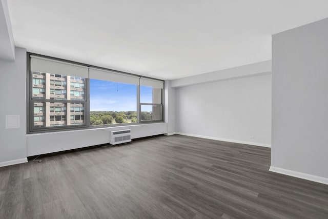 3600 N Lake Shore Dr Unit 1004, Chicago, IL 60613 - spare room featuring wood finished floors and an AC wall unit