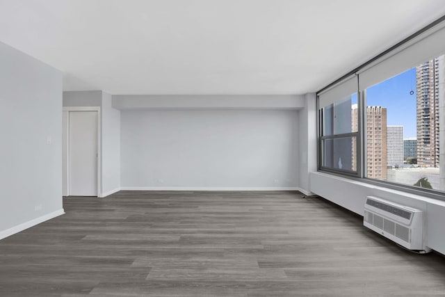 3600 N Lake Shore Dr Unit 1004, Chicago, IL 60613 - empty room with wood finished floors, a view of city, and a wall mounted AC
