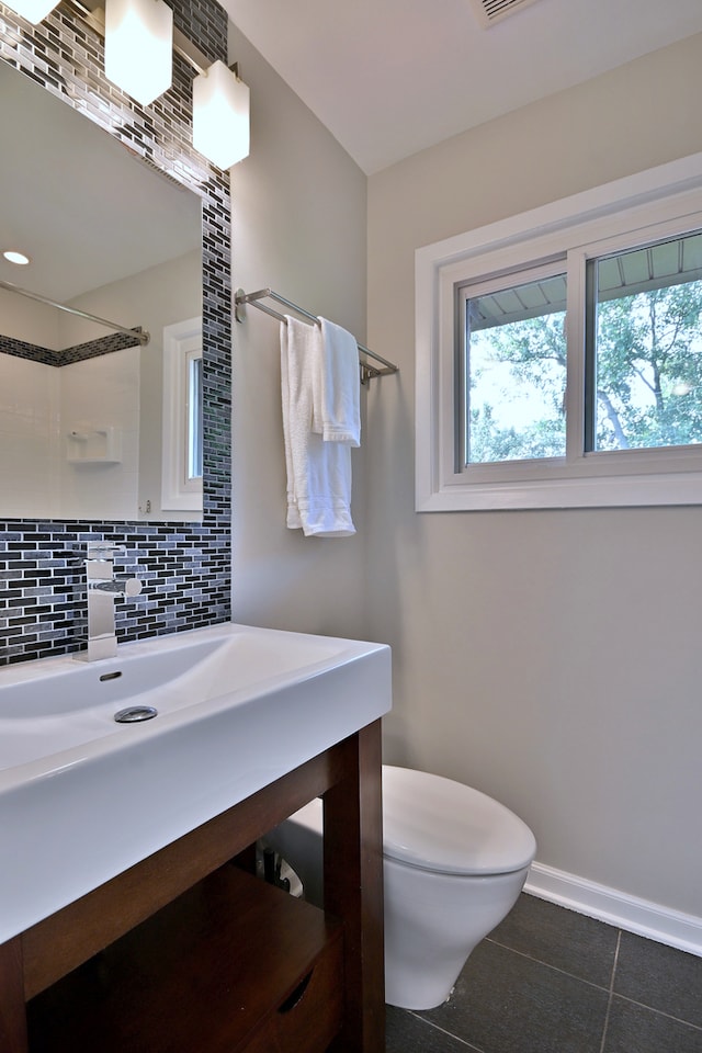 300 Duane St Unit 6, Glen Ellyn, IL 60137 - full bathroom with plenty of natural light, decorative backsplash, tile patterned flooring, and a shower