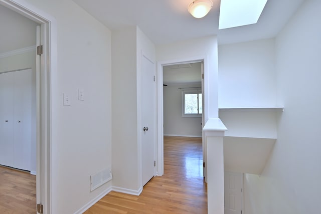 300 Duane St Unit 6, Glen Ellyn, IL 60137 - hallway featuring a skylight and light wood-type flooring