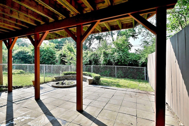 300 Duane St Unit 6, Glen Ellyn, IL 60137 - fenced backyard with a patio area and a fire pit