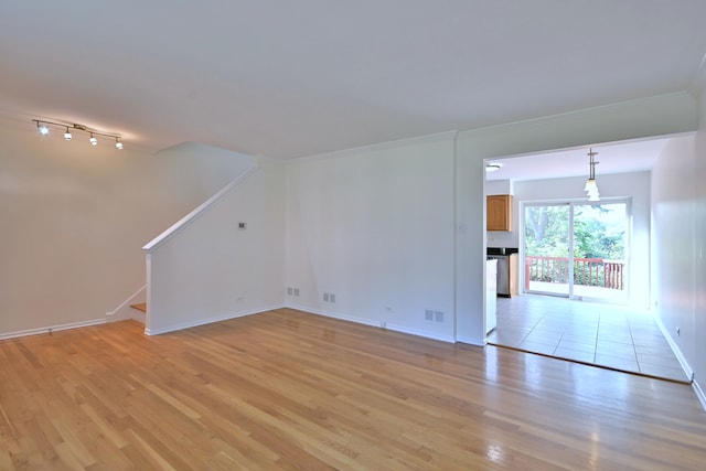 300 Duane St Unit 6, Glen Ellyn, IL 60137 - spare room with light wood-style floors, ornamental molding, and stairs