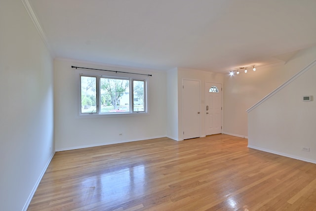 300 Duane St Unit 6, Glen Ellyn, IL 60137 - spare room with crown molding and light wood finished floors