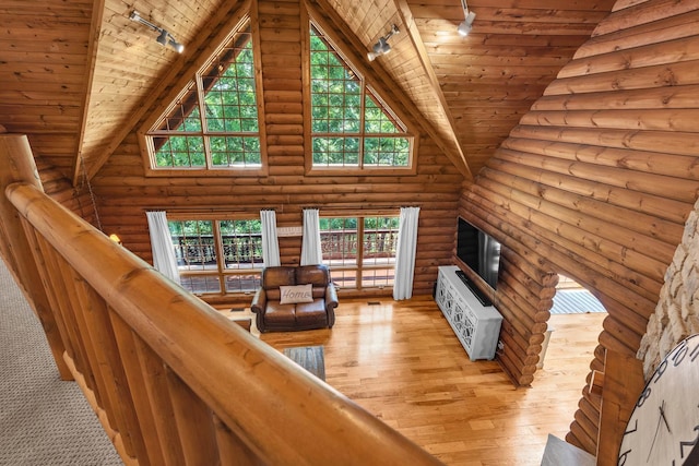 3903 Niblick Ct, Crystal Lake, IL 60012 - living area featuring rail lighting, wooden ceiling, light wood finished floors, log walls, and high vaulted ceiling