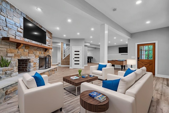 3903 Niblick Ct, Crystal Lake, IL 60012 - living room featuring billiards table, a stone fireplace, light wood-style floors, stairs, and recessed lighting