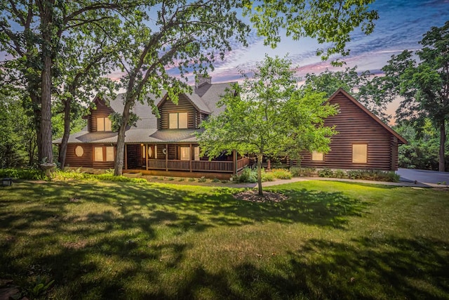 3903 Niblick Ct, Crystal Lake, IL 60012 - back of property featuring log siding, a lawn, and covered porch