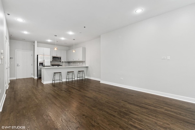 150 W Superior St Unit 605, Chicago, IL 60654 - unfurnished living room featuring dark wood-type flooring and recessed lighting