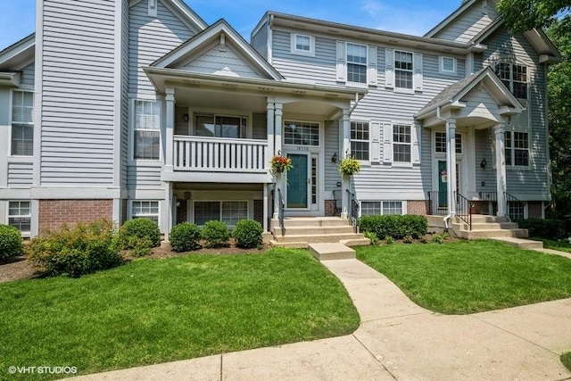 18550 W Sterling Ct W Unit 18550, Grayslake, IL 60030 - view of front facade with a front yard and a balcony