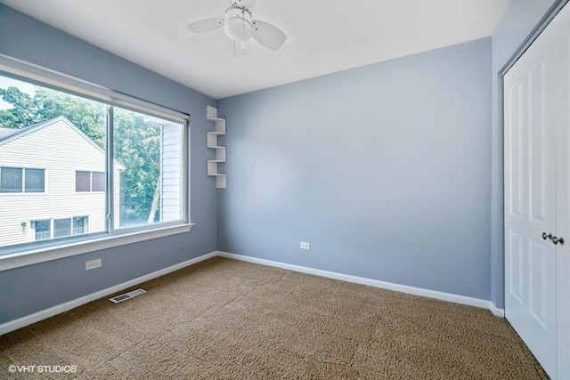 18550 W Sterling Ct W Unit 18550, Grayslake, IL 60030 - carpeted spare room with baseboards and ceiling fan