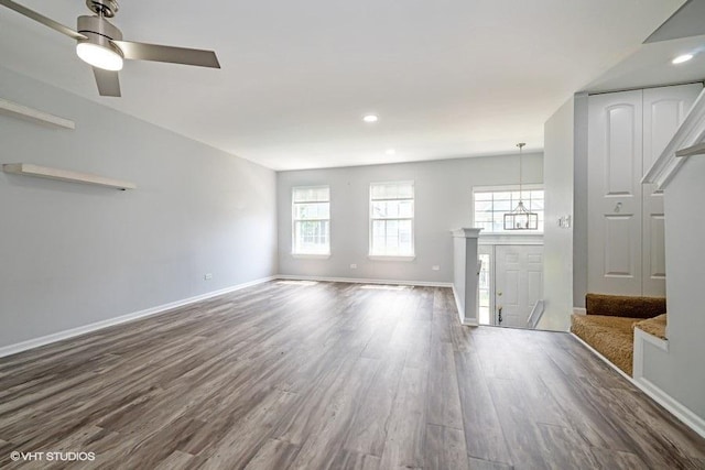 18550 W Sterling Ct W Unit 18550, Grayslake, IL 60030 - unfurnished living room featuring dark wood-style flooring, healthy amount of natural light, a ceiling fan, and recessed lighting