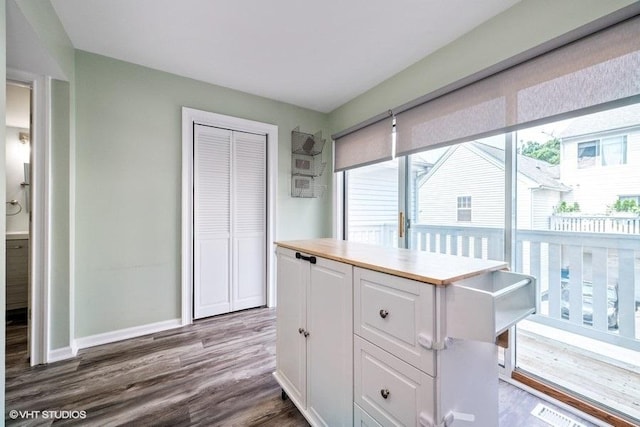 18550 W Sterling Ct W Unit 18550, Grayslake, IL 60030 - kitchen featuring healthy amount of natural light, white cabinetry, wood finished floors, and light countertops