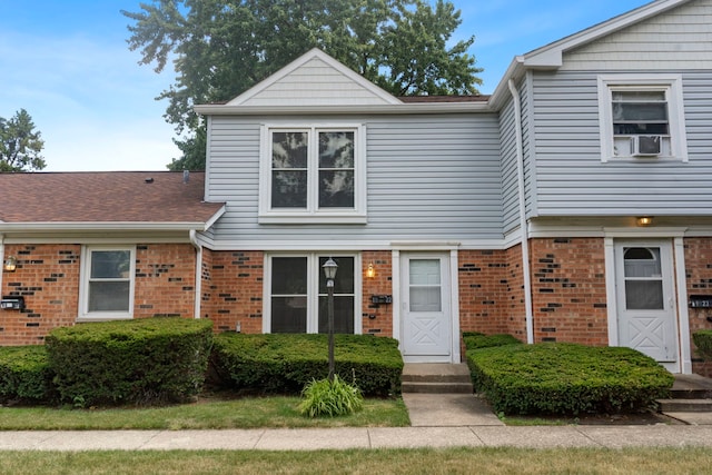 1022 Ashton Ct, Streamwood, IL 60107 - view of front facade with brick siding and roof with shingles