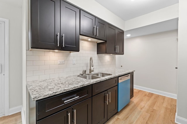 1022 Ashton Ct, Streamwood, IL 60107 - kitchen with dishwashing machine, light wood-type flooring, tasteful backsplash, light stone countertops, and dark brown cabinets