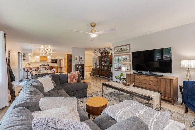 16064 Raintree Rd, Bloomington, IL 61705 - living area featuring a chandelier, light wood-style flooring, and ceiling fan