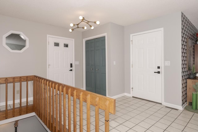 16064 Raintree Rd, Bloomington, IL 61705 - entrance foyer with a chandelier and light tile patterned flooring