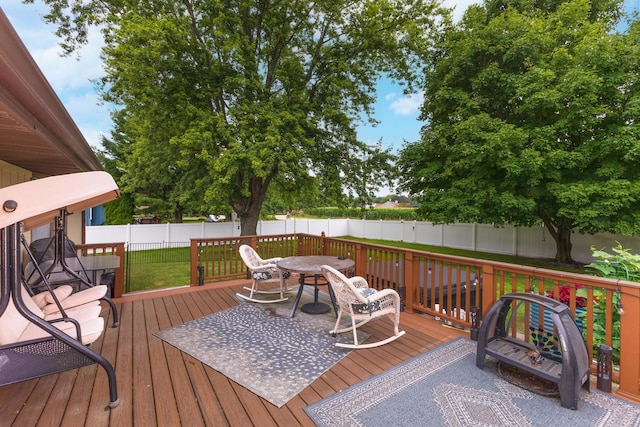 16064 Raintree Rd, Bloomington, IL 61705 - wooden deck with a fenced backyard and outdoor dining area