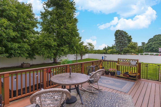 16064 Raintree Rd, Bloomington, IL 61705 - wooden deck with a fenced backyard and outdoor dining space