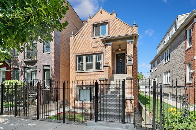 1630 S Fairfield Ave, Chicago, IL 60608 - view of property with brick siding, a fenced front yard, and a gate
