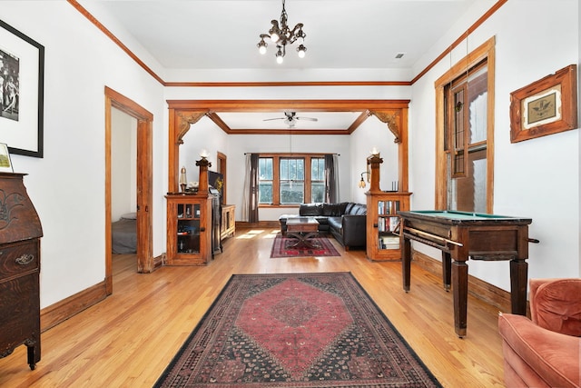 1630 S Fairfield Ave, Chicago, IL 60608 - hallway with light wood-type flooring, crown molding, and a chandelier