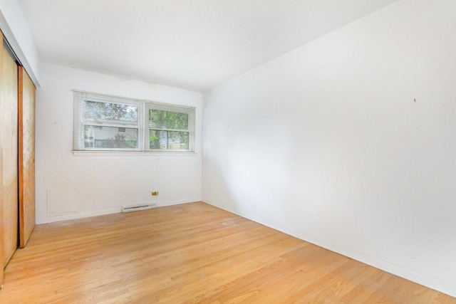 712 Central Park Ave, Flossmoor, IL 60422 - unfurnished bedroom with a closet and light wood finished floors