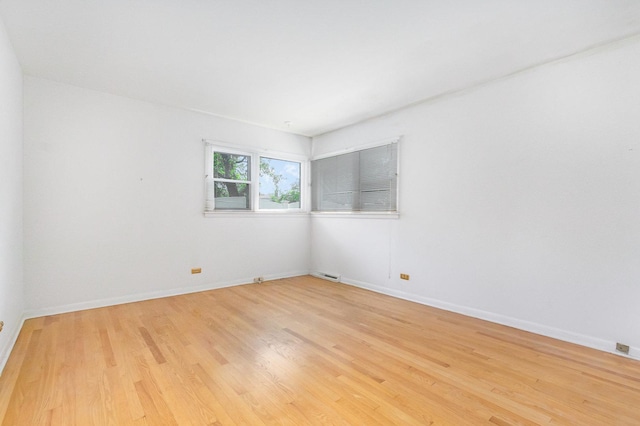 712 Central Park Ave, Flossmoor, IL 60422 - empty room with light wood-style floors and baseboards