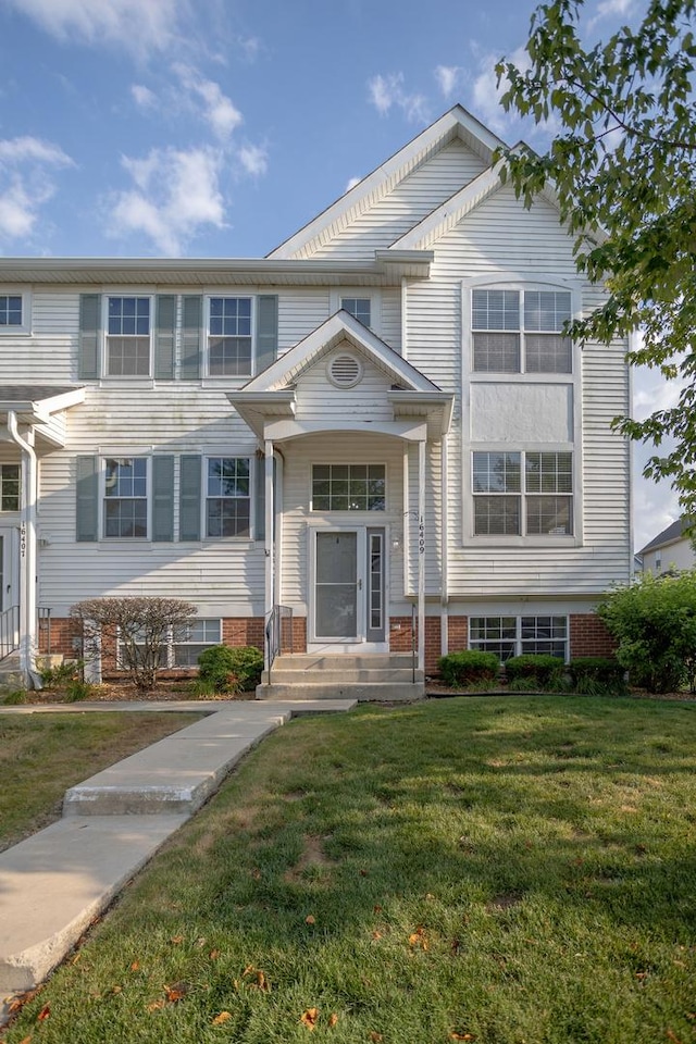16409 Teton Dr Unit D, Lockport, IL 60441 - view of front of property featuring a front yard and brick siding