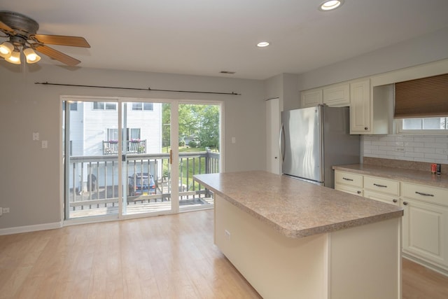 16409 Teton Dr Unit D, Lockport, IL 60441 - kitchen featuring freestanding refrigerator, ceiling fan, tasteful backsplash, recessed lighting, and light wood-style floors
