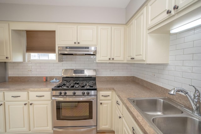 16409 Teton Dr Unit D, Lockport, IL 60441 - kitchen with gas stove, under cabinet range hood, and cream cabinets
