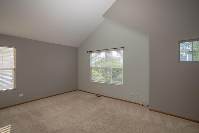16409 Teton Dr Unit D, Lockport, IL 60441 - empty room with plenty of natural light, light colored carpet, and vaulted ceiling