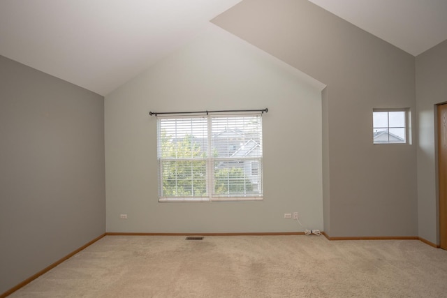 16409 Teton Dr Unit D, Lockport, IL 60441 - spare room with vaulted ceiling, healthy amount of natural light, and light colored carpet