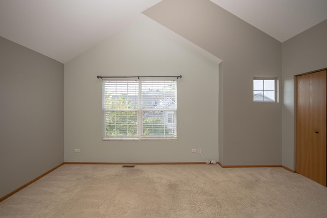 16409 Teton Dr Unit D, Lockport, IL 60441 - spare room featuring vaulted ceiling and light colored carpet