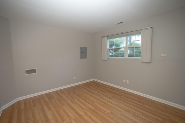 16409 Teton Dr Unit D, Lockport, IL 60441 - spare room featuring light wood-type flooring and electric panel