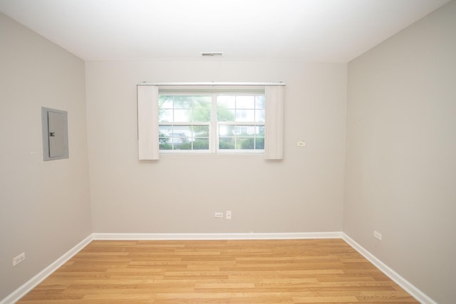 16409 Teton Dr Unit D, Lockport, IL 60441 - empty room featuring electric panel and light wood-style floors
