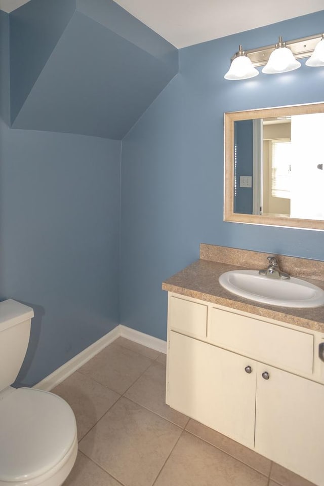 16409 Teton Dr Unit D, Lockport, IL 60441 - bathroom with vanity, tile patterned floors, and lofted ceiling