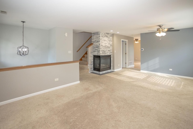 16409 Teton Dr Unit D, Lockport, IL 60441 - unfurnished living room featuring light carpet, a ceiling fan, stairway, and recessed lighting