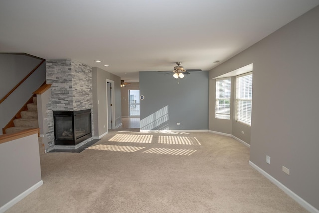16409 Teton Dr Unit D, Lockport, IL 60441 - unfurnished living room featuring light colored carpet, a fireplace, stairs, ceiling fan, and recessed lighting