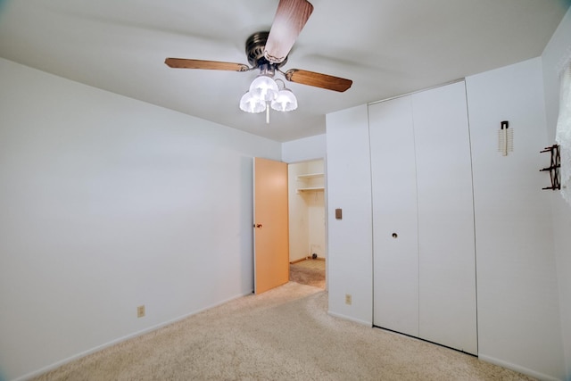 100 W Herron Ct, Watseka, IL 60970 - unfurnished bedroom featuring carpet flooring, a closet, and a ceiling fan