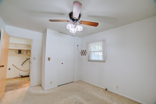 100 W Herron Ct, Watseka, IL 60970 - unfurnished bedroom with carpet, a closet, and a ceiling fan