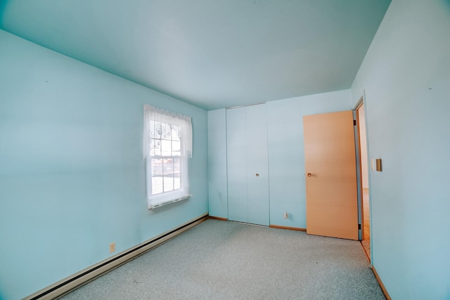 100 W Herron Ct, Watseka, IL 60970 - unfurnished bedroom with a baseboard radiator, carpet flooring, and a closet