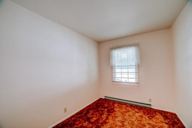 100 W Herron Ct, Watseka, IL 60970 - carpeted spare room featuring a baseboard heating unit and baseboards