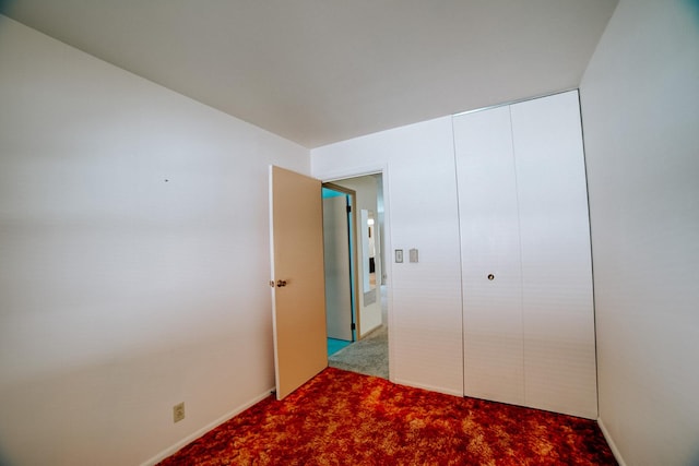 100 W Herron Ct, Watseka, IL 60970 - unfurnished bedroom featuring carpet floors