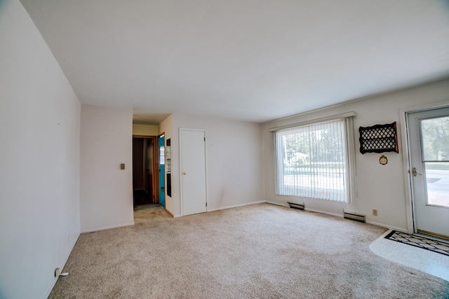 100 W Herron Ct, Watseka, IL 60970 - unfurnished living room with carpet flooring and baseboards