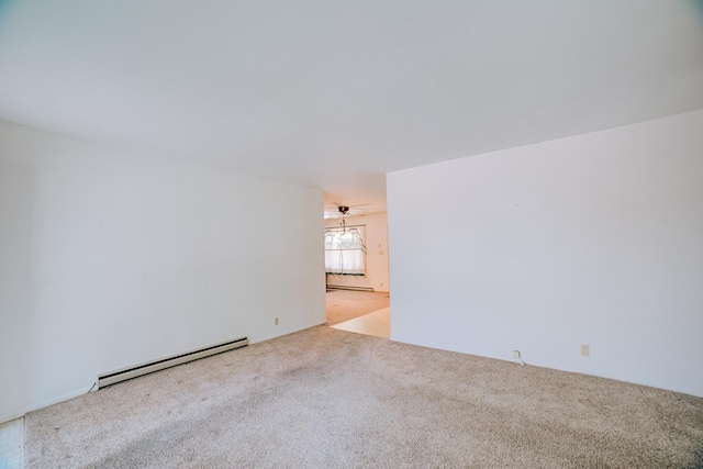 100 W Herron Ct, Watseka, IL 60970 - unfurnished room featuring a baseboard radiator and carpet
