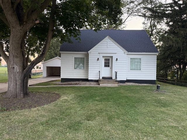 10N850 Rippburger Rd, Elgin, IL 60124 - bungalow with a front yard, roof with shingles, and an outbuilding