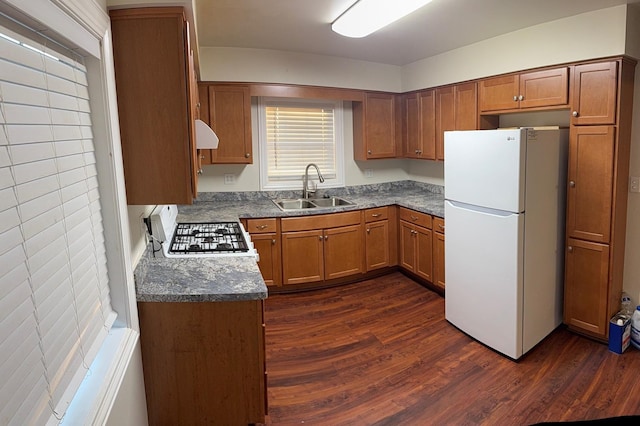 10N850 Rippburger Rd, Elgin, IL 60124 - kitchen featuring freestanding refrigerator, dark wood-style floors, brown cabinets, and extractor fan